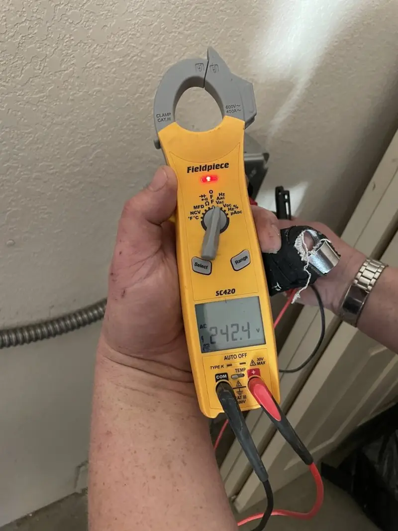 Voltage testing with clamp meter during Ceiling Fan Installation in Ogden